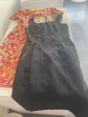 2 ANTONIO MELANI Laser-Cut Dresses. Both size 0. Great condition. Will separate.